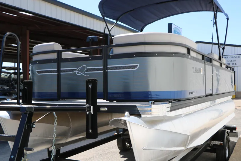 Slide: The Image of 2023 Qwest E820 XRE CR L pontoon boat on trailer, featuring sleek design and canopy. - 5