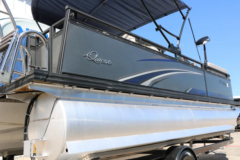 Slide: The Image of 2023 Qwest E820 XRE CR L pontoon boat with sleek design and modern features. - 8