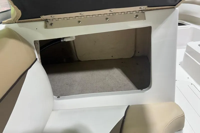 Slide: The Image of Storage compartment in a 2014 Starcraft Crossover 230 SCX IO boat interior. - 23