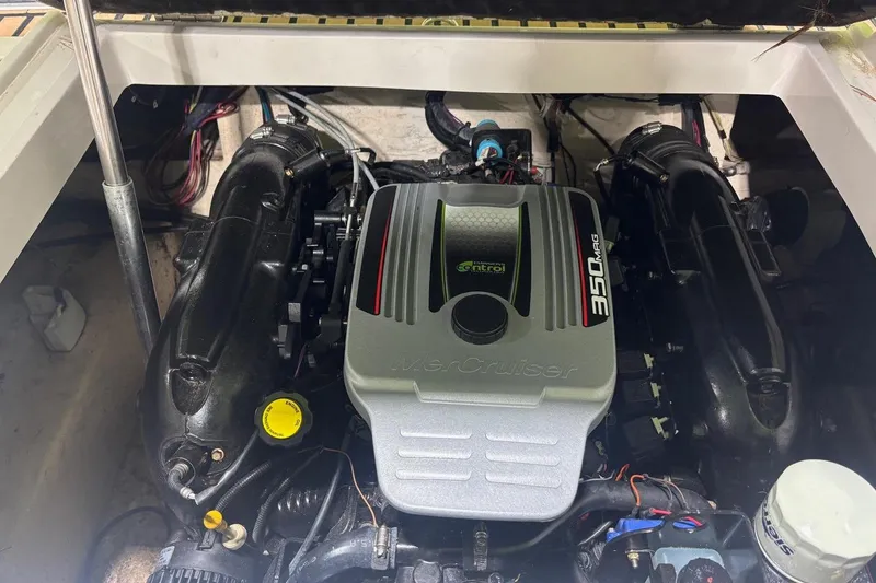 Slide: The Image of Engine compartment of a 2014 Starcraft Crossover 230 SCX IO with MerCruiser 350 MAG. - 24