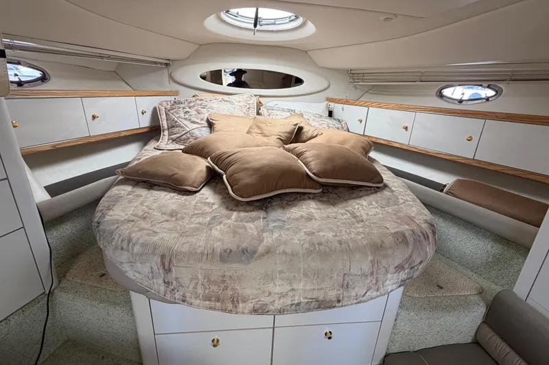 Slide: The Image of Luxurious cabin interior of a 1996 Maxum 3700 SCR yacht with plush bedding. - 11