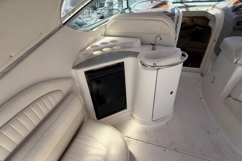 Slide: The Image of Interior of 1996 Maxum 3700 SCR yacht with seating, sink, and storage. - 17