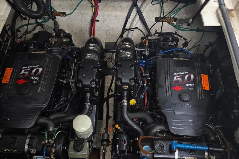 Slide: The Image of Engine compartment of a 2004 Cruisers 320 Express with twin MerCruiser 5.0 MPI engines. - 15