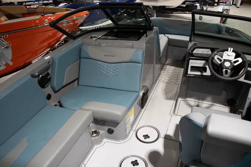 Slide: The Image of Interior of 2026 MasterCraft NXT22 with modern seating and control console. - 7