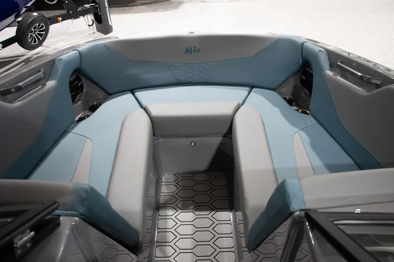 Slide: The Image of Interior of 2026 MasterCraft NXT22 with blue and gray seating. - 8