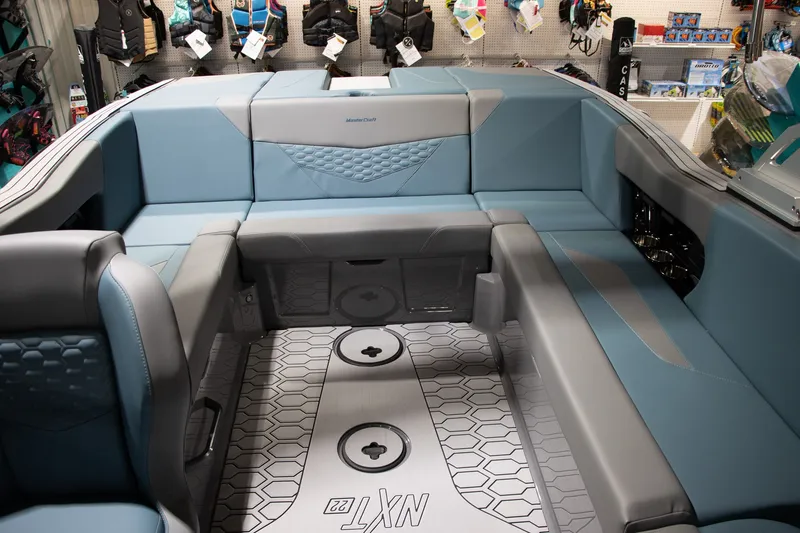 Slide: The Image of Interior of 2026 MasterCraft NXT22 with blue upholstery. - 9