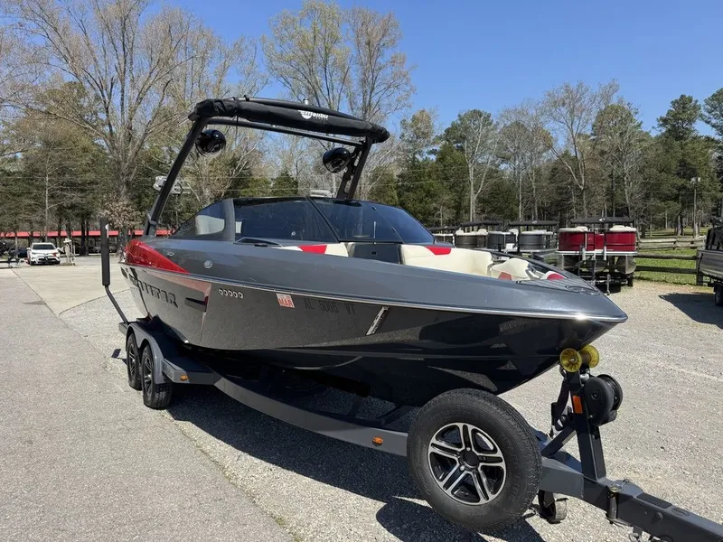 Slide: The Image of 2015 Malibu Wakesetter 22 VLX boat on trailer outdoors. - 4