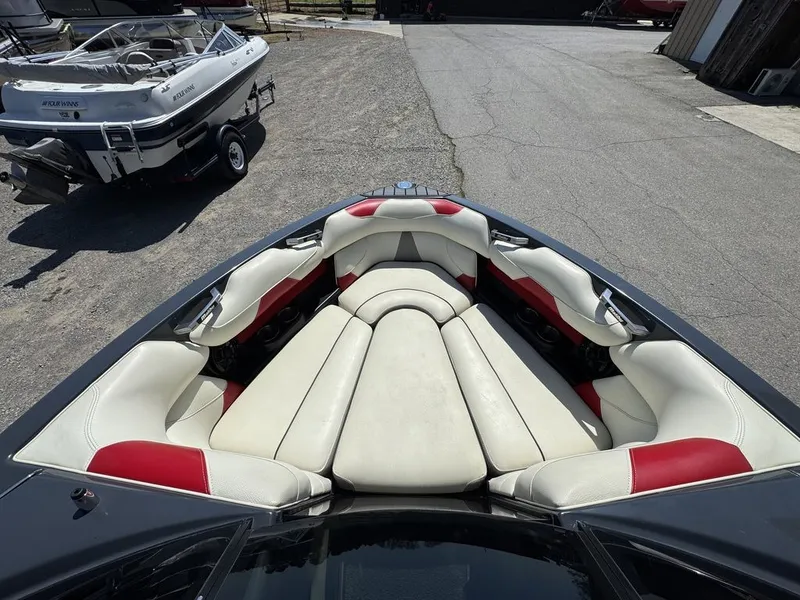 Slide: The Image of Interior of a 2015 Malibu Wakesetter 22 VLX with white and red seating. - 5
