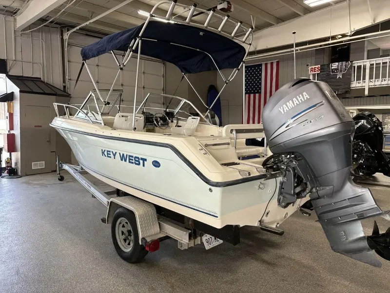 Slide: The Image of 2004 Key West 200 DC boat with Yamaha engine in a garage. - 3