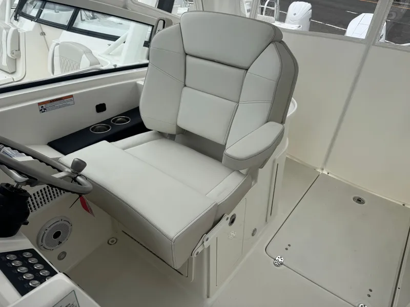 Slide: The Image of Interior of 2026 World Cat 325DC featuring luxurious captain's chair. - 10