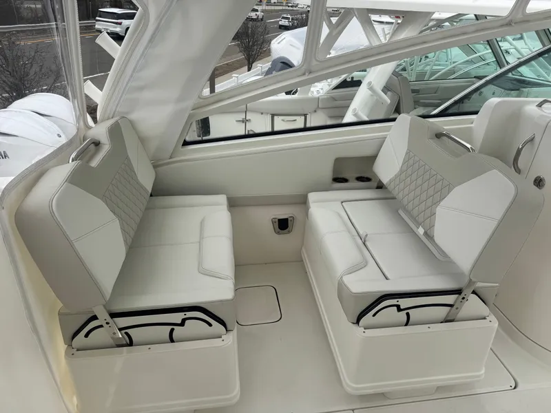 Slide: The Image of Interior of 2026 World Cat 325DC featuring luxurious white seating. - 12