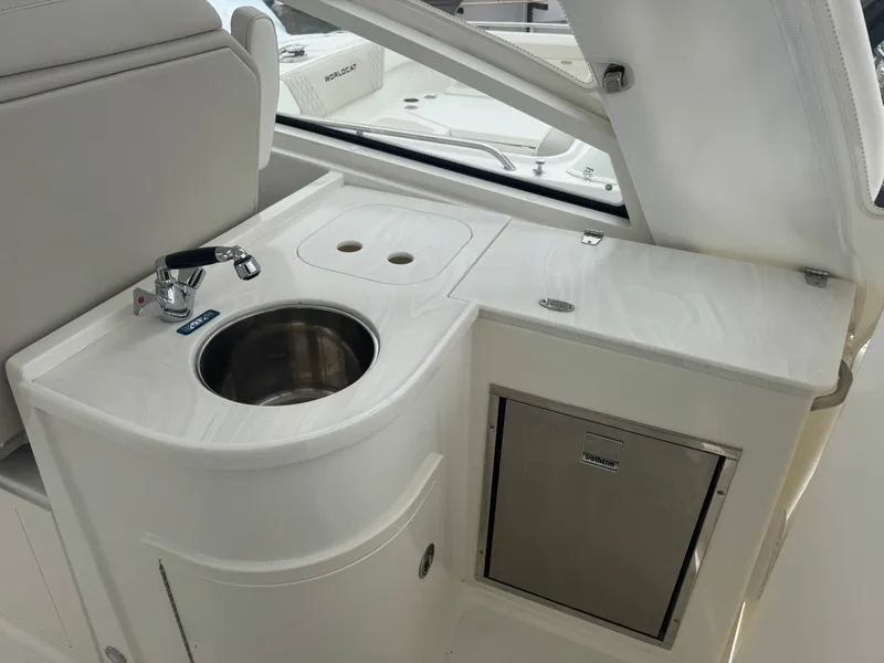 Slide: The Image of Interior of 2026 World Cat 325DC with sink and refrigerator. - 17
