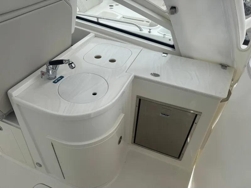 Slide: The Image of Interior of 2026 World Cat 325DC with sink and refrigerator. - 18