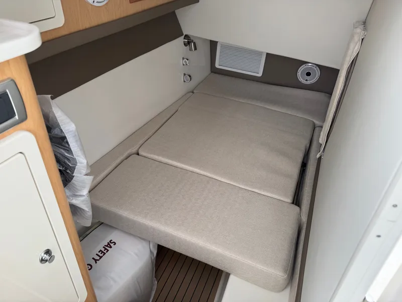 Slide: The Image of Interior of 2026 World Cat 325DC with cushioned seating area. - 22