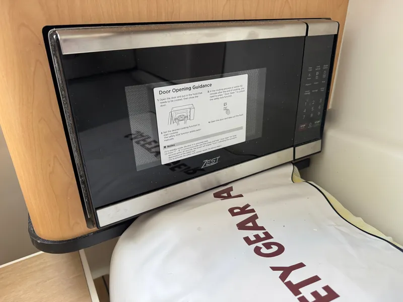 Slide: The Image of Microwave in a 2026 World Cat 325DC boat. - 23