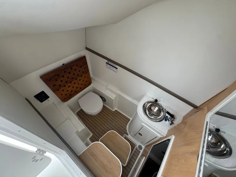 Slide: The Image of Interior of 2026 World Cat 325DC with toilet and sink. - 24