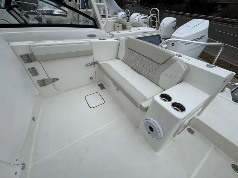 Slide: The Image of Interior of 2026 World Cat 325DC with seating and cup holders. - 27