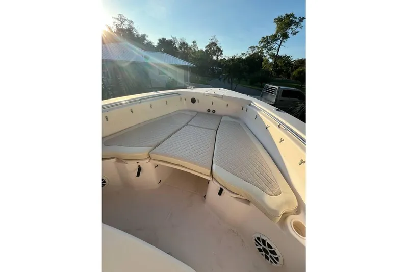 Slide: The Image of 2007 Grady-White Bimini 306 boat interior with cushioned seating and sunlight. - 3