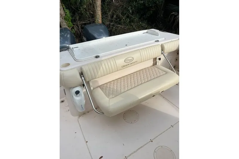 Slide: The Image of 2007 Grady-White Bimini 306 boat with beige seating and Yamaha engines. - 4