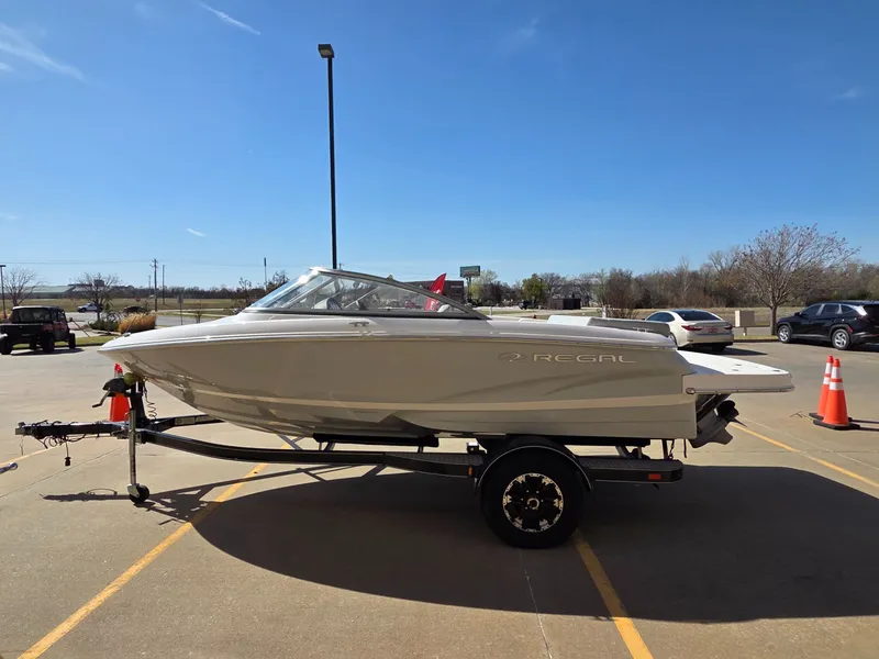 Slide: The Image of 2019 Regal 1900 ES Bowrider on trailer in sunny weather. - 5