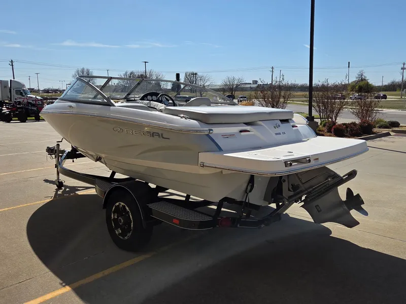 Slide: The Image of 2019 Regal 1900 ES Bowrider on trailer outdoors. - 6