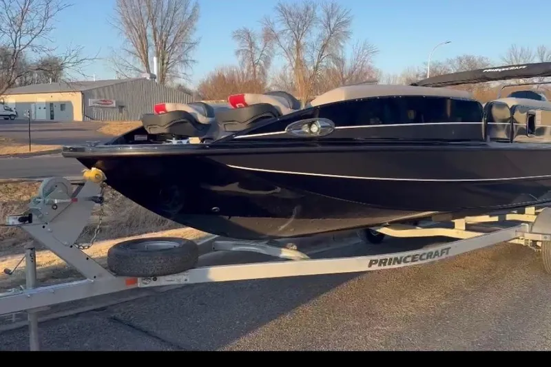 The Image of 2026 Princecraft Ventura 224 boat on trailer, parked outdoors in a sunny setting. - 1