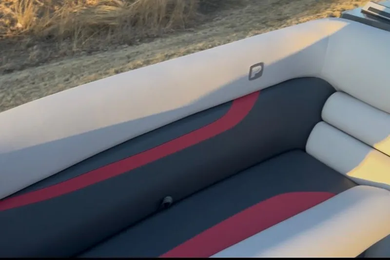 Slide: The Image of Interior seating of 2026 Princecraft Ventura 224 boat, featuring sleek gray and red design. - 10