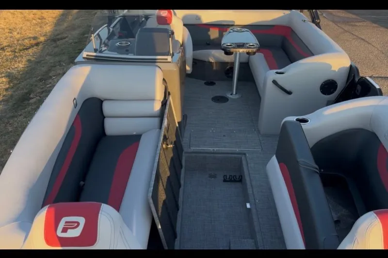 Slide: The Image of 2026 Princecraft Ventura 224 boat interior with gray and red seating, sleek design. - 11