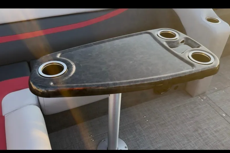 Slide: The Image of Luxurious seating and table with cup holders on 2026 Princecraft Ventura 224 boat. - 12