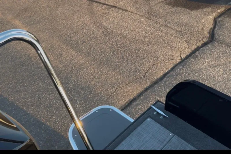 Slide: The Image of 2026 Princecraft Ventura 224 boat deck with metal railing and textured flooring. - 20