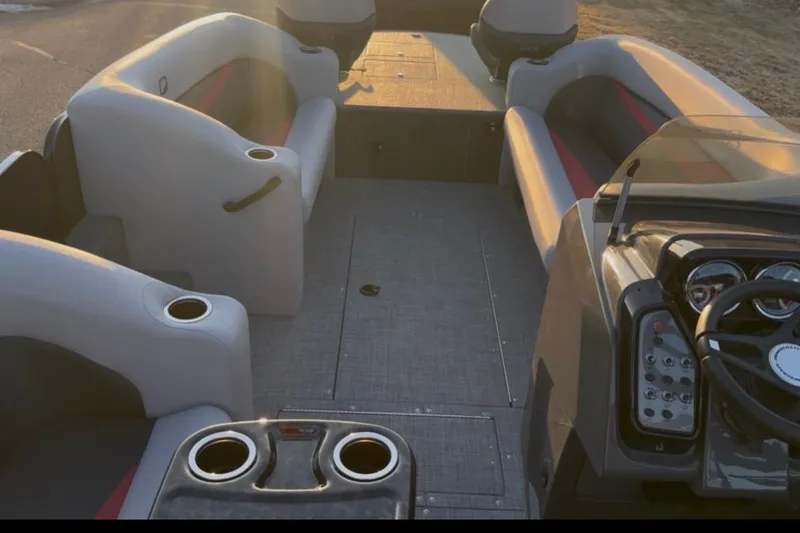 Slide: The Image of Interior view of a 2026 Princecraft Ventura 224 boat with seating and control panel. - 5
