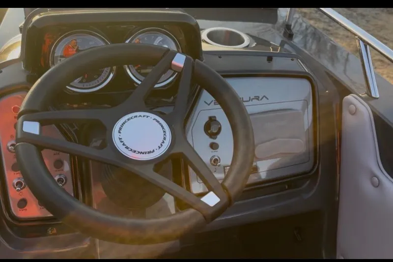 Slide: The Image of Steering console of 2026 Princecraft Ventura 224 boat with gauges and controls. - 6