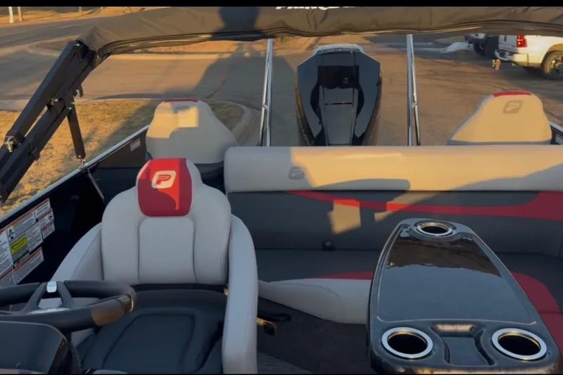 Slide: The Image of Interior of a 2026 Princecraft Ventura 224 boat with seating and cup holders. - 7