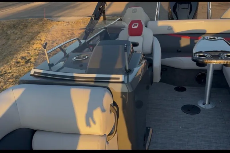 Slide: The Image of 2026 Princecraft Ventura 224 boat interior with seating and table, showcasing modern design. - 8