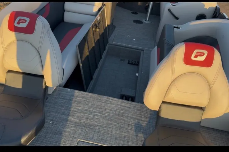 Slide: The Image of Interior of 2026 Princecraft Ventura 224 boat with stylish seating and storage compartments. - 9