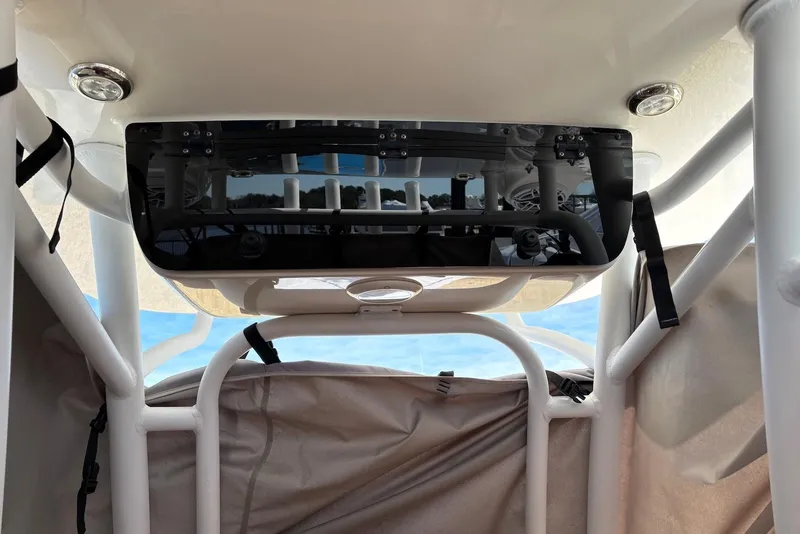 Slide: The Image of 2023 Sportsman Open 232 Center Console interior view with storage and equipment. - 11