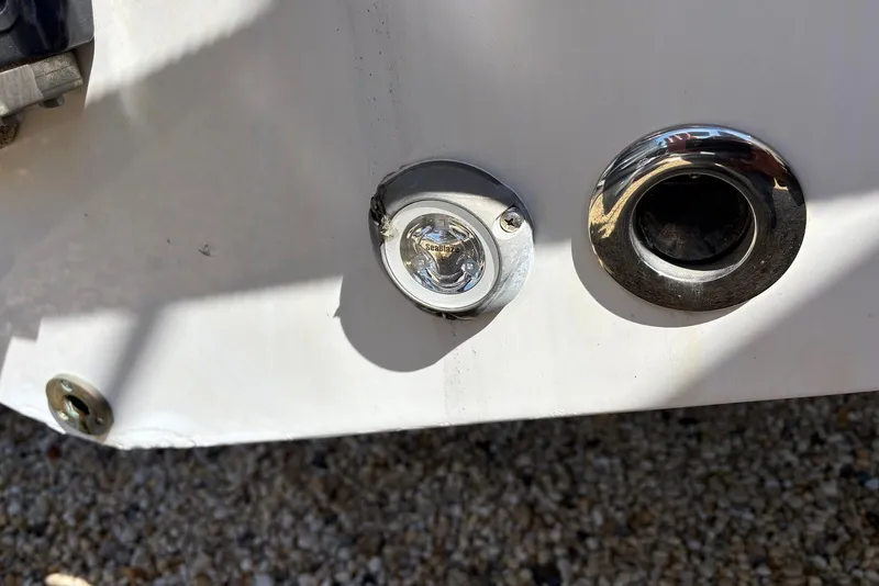 Slide: The Image of Close-up of 2023 Sportsman Open 232 Center Console boat fittings and light. - 13