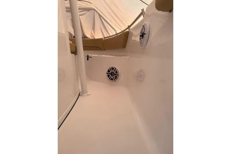 Slide: The Image of 2023 Sportsman Open 232 Center Console interior with speakers and seating. - 9