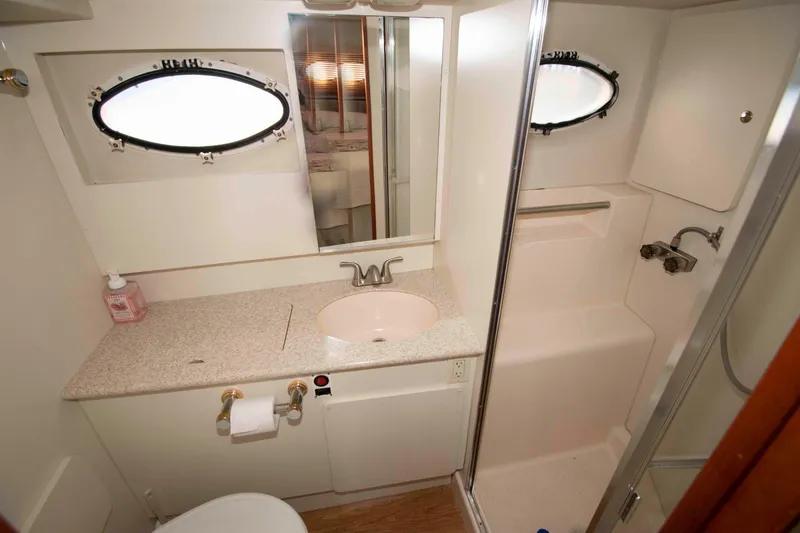 Slide: The Image of Bathroom interior of 2001 Silverton 392 Motor Yacht with sink and shower. - 18