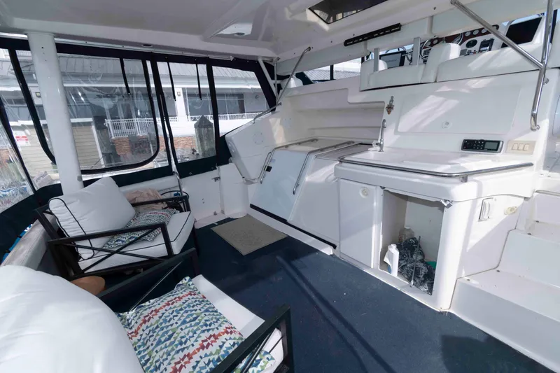 Slide: The Image of Interior of 2001 Silverton 392 Motor Yacht with seating and storage area. - 2