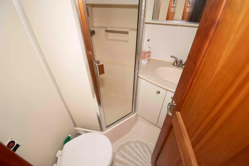 Slide: The Image of Bathroom interior of 2001 Silverton 392 Motor Yacht with shower and sink. - 20