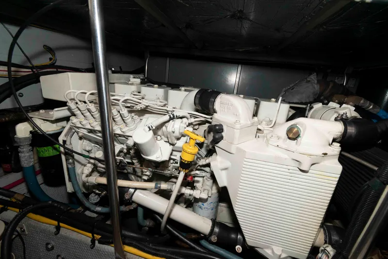 Slide: The Image of Engine room of a 2001 Silverton 392 Motor Yacht, showcasing mechanical components. - 22