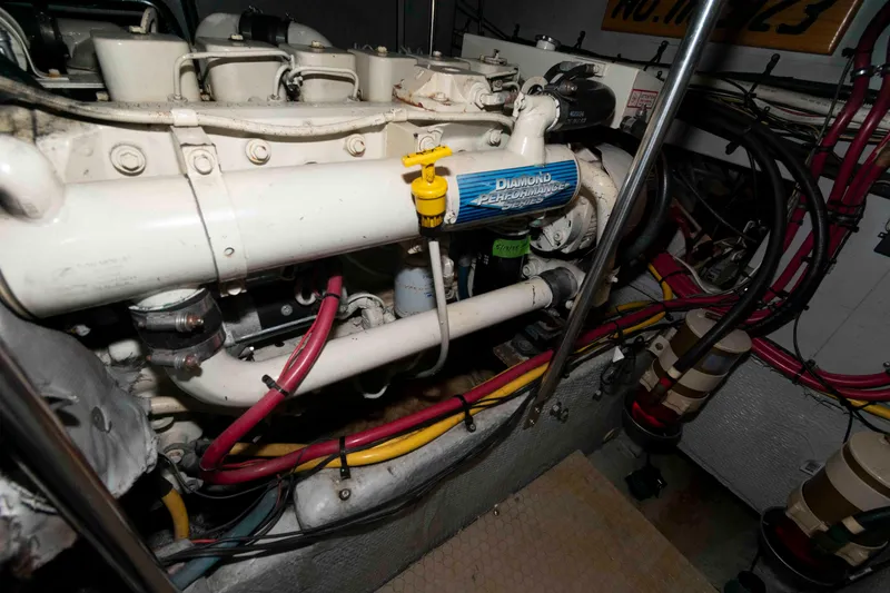 Slide: The Image of Engine room of a 2001 Silverton 392 Motor Yacht with visible wiring and components. - 23
