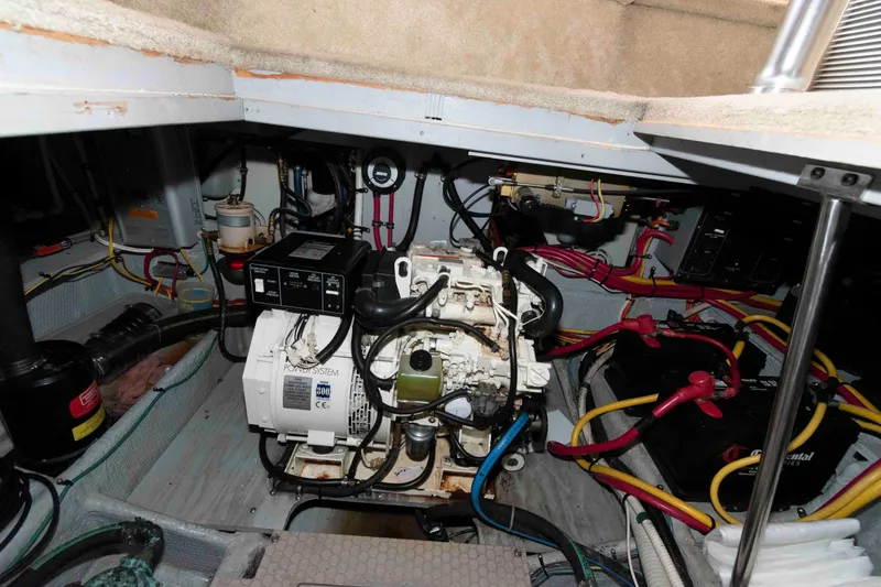 Slide: The Image of Engine room of a 2001 Silverton 392 Motor Yacht with visible wiring and components. - 24