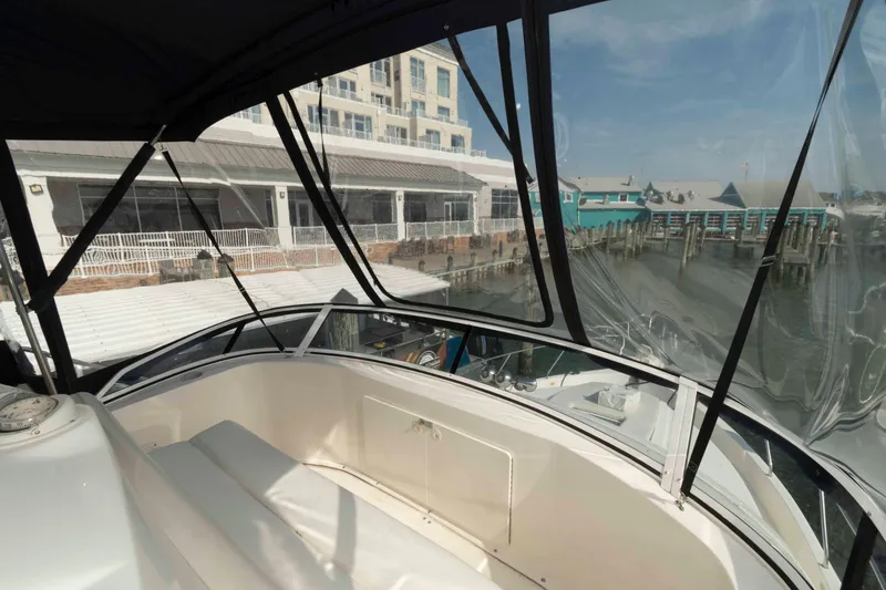 Slide: The Image of 2001 Silverton 392 Motor Yacht interior with marina view through clear windows. - 7