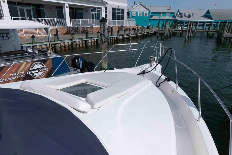 Slide: The Image of 2001 Silverton 392 Motor Yacht docked near waterfront buildings. - 9