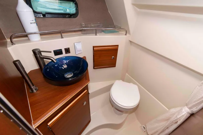 Slide: The Image of 2020 Ranger Tugs R-27 boat bathroom with modern sink and toilet. - 15