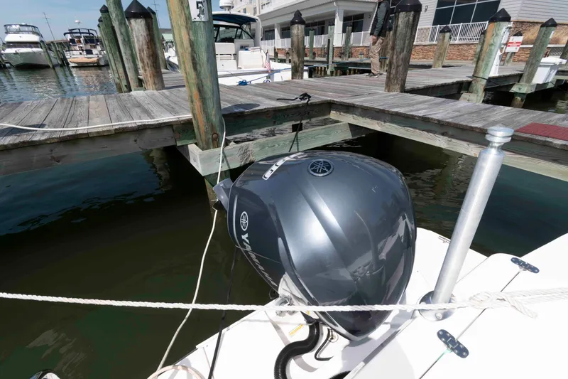 Slide: The Image of 2020 Ranger Tugs R-27 with Yamaha outboard motor docked at marina. - 18