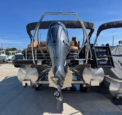 Slide: The Image of Bennington 23MSB 2026 pontoon boat with outboard motor, rear view. - 12