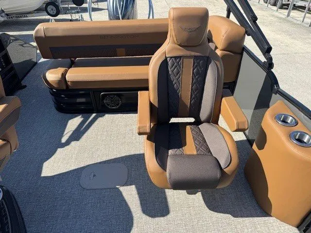 Slide: The Image of Luxurious interior of 2026 Bennington 23MSB with brown leather seating. - 16